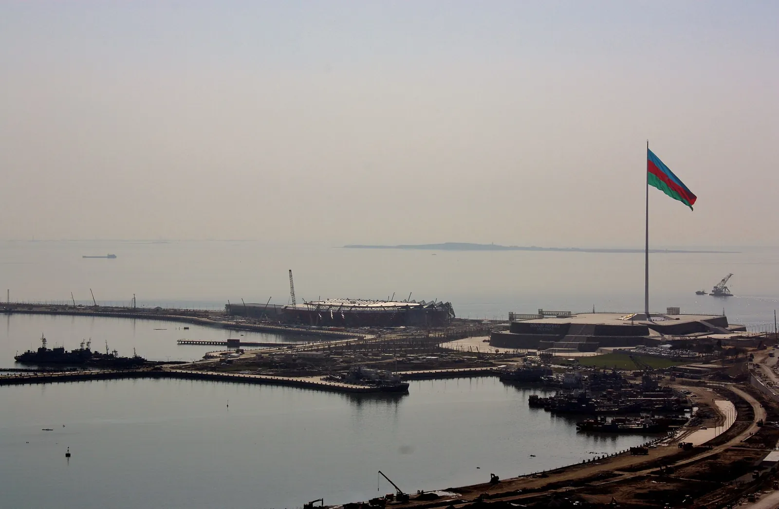 Crystal Hall under construction on the Baku shoreline in March 2012, its steel roof frame beside the State Flag Square.