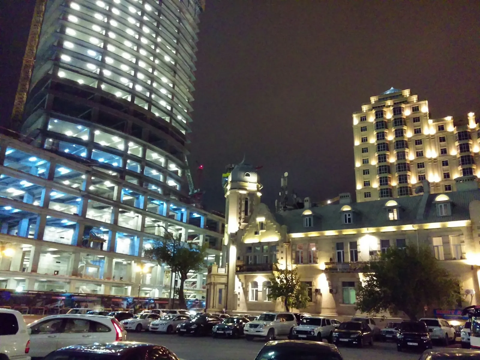 Port Baku district at night in 2014, a tower still under construction on the left.